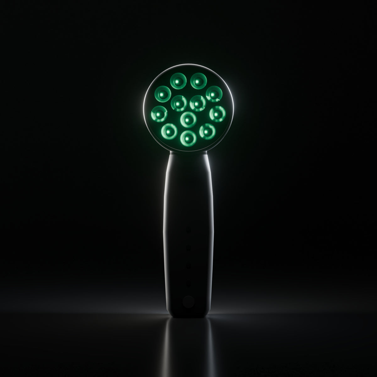 Front view of the DRKD Retreat 21 in a dark room with all 12 LED wells lit green on the black round head.