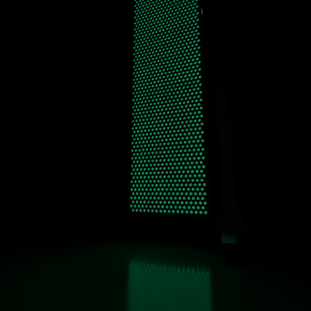 DRKD Retreat 189 lit green in a dark room, the panel light spilling across the glossy floor beside it.