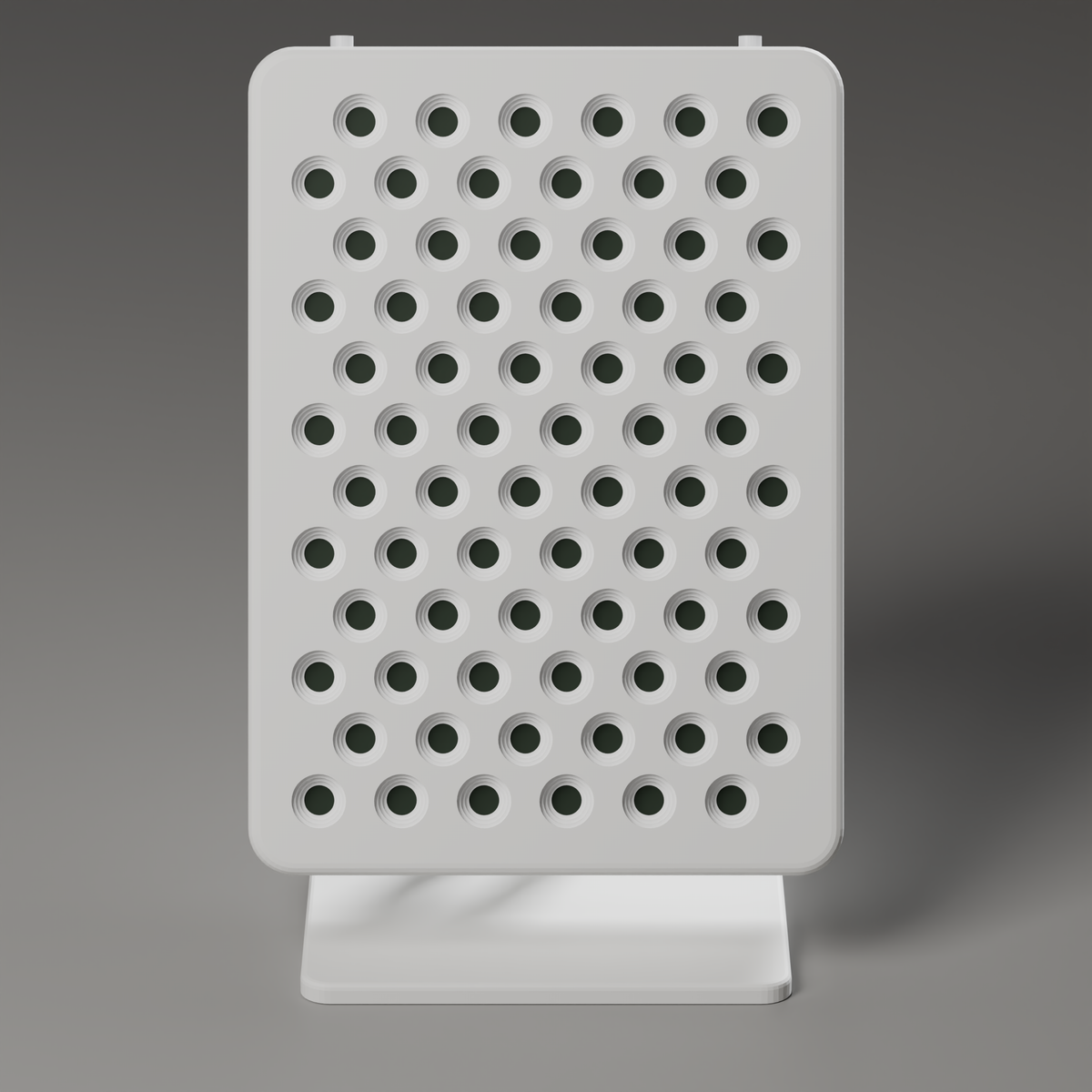 Front view of the DRKD Retreat 32 with its LEDs off, showing 72 unlit reflector cups in 12 staggered rows of 6 across the white face.