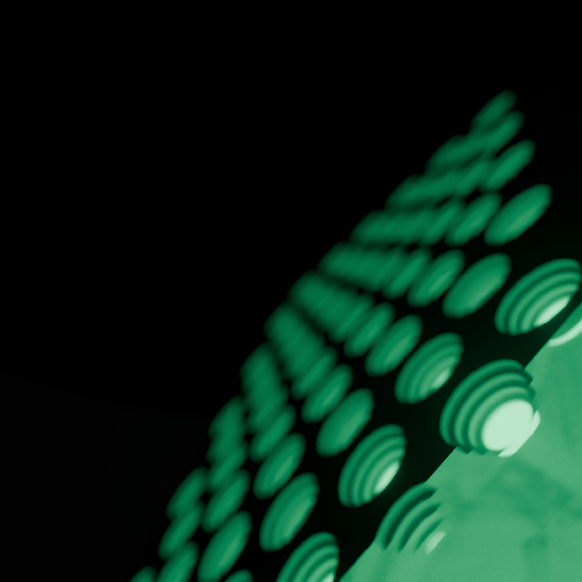 Raking close view across the lit face of the DRKD Retreat 32, staggered rows of green LEDs in reflector cups.