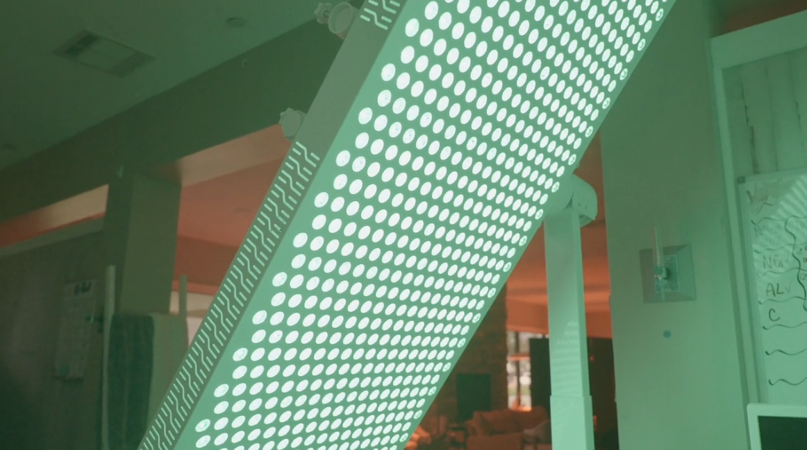 A corner of a clinic room, lit in green.